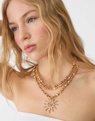 Collier long avec pendentif soleil - Dor - Stradivarius - Modalova
