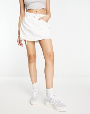 Stradivarius denim mini skirt with raw hem in white | ASOS