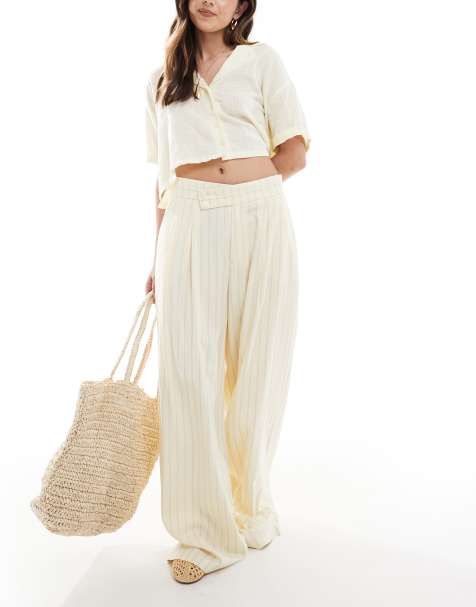 Stradivarius pleat front wide leg tailored trousers in pale yellow pinstripe