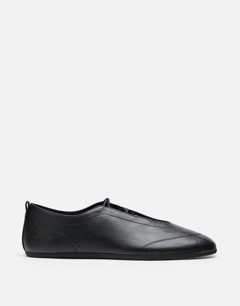 Stradivarius Elasticated criss-cross strap sneakerinas in black - view 1