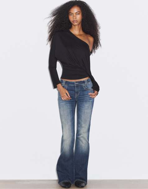 Stradivarius Embroidered pocket bell bottom jeans in medium denim wash - view 1