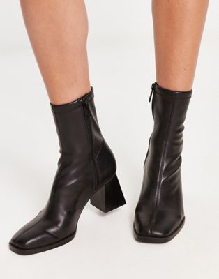Stradivarius faux leather heeled sock boot in black