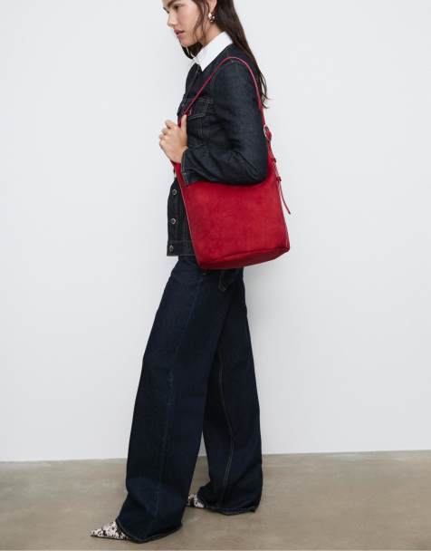 Stradivarius Faux suede bucket bag with buckle in red - view 1