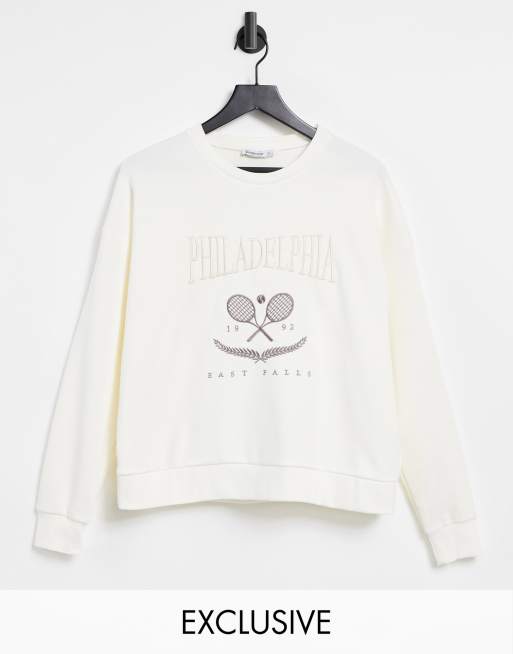Stradivarius - Felpa stile college in cotone écru con scritta 