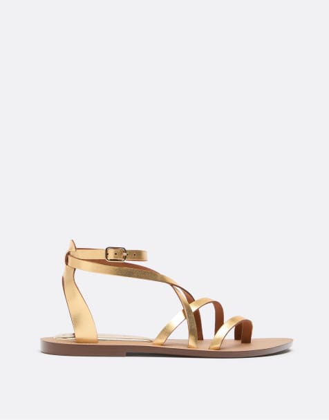 Stradivarius – Flache Ledersandalen in Gold mit Schnürung - view 1