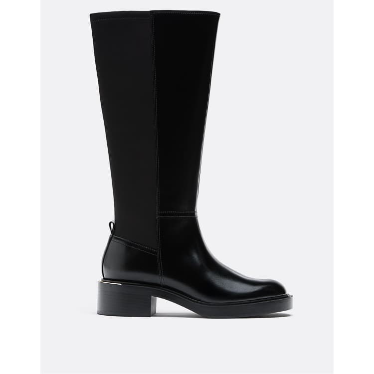 Stradivarius – Flache schwarze Stiefel im Reiterstiefel-Look ASOS