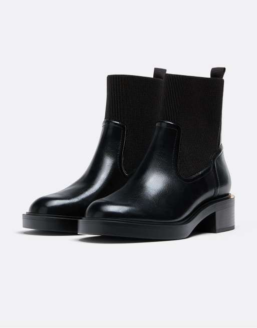 Stradivarius Flat black ankle boots in black