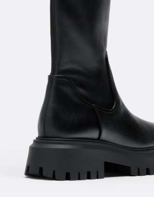 Stradivarius Flat knee-high boots in black ASOS