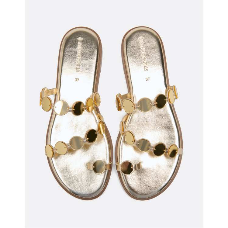 Stradivarius Flat mirror stud sandals in gold | ASOS