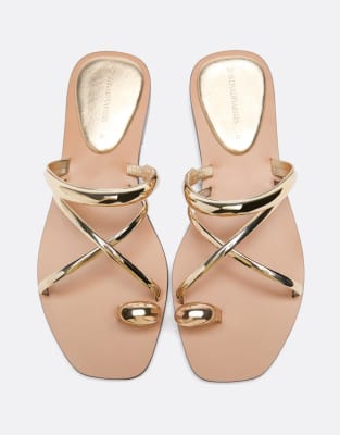 Stradivarius Flat slide sandals with detail in gold
