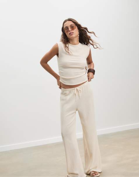 Stradivarius Flowing creased-effect trousers in vanilla - view 1