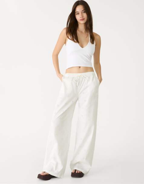 Stradivarius Flowing trousers with embroidery in white