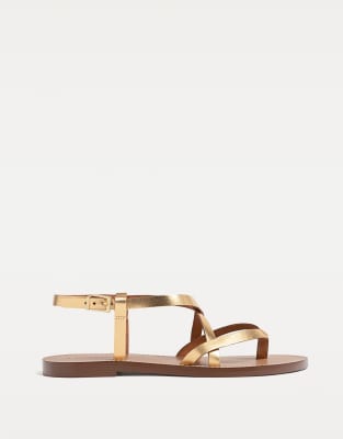 Stradivarius – Guldfärgade, platta sandaler i läder med remmar - view 1