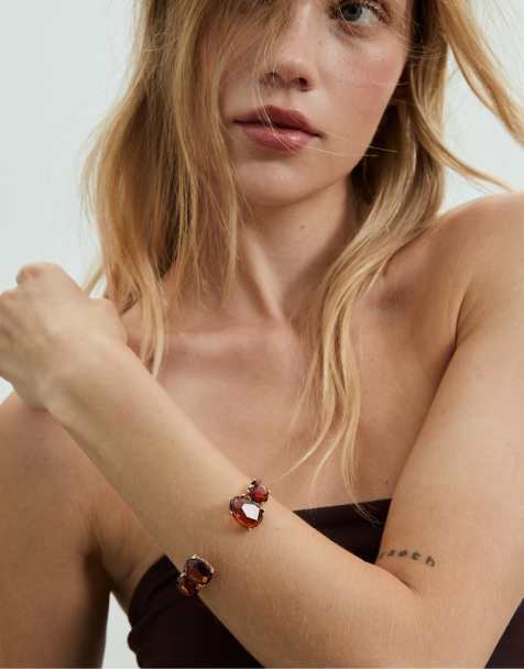 Stradivarius – Guldfärgat, styvt armband med strass - view 1