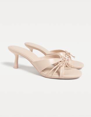  Heeled sandals with bow in beige-pink