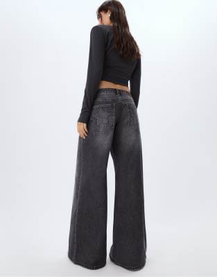 Stradivarius - Jean ample taille basse avec étoiles - Noir délavé-Gris