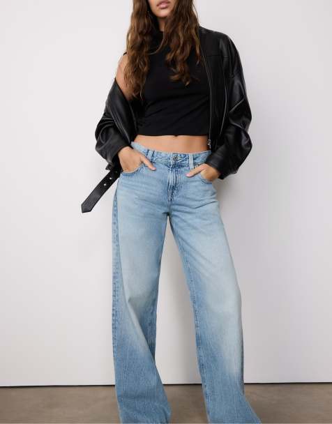 Stradivarius - Jeans met wijde pijpen, lage taille en sterdetail in overdyed blauw denim - view 1