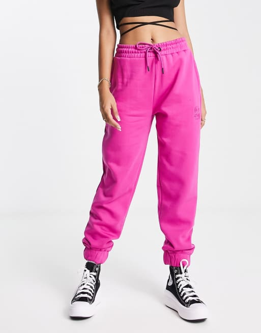 Stradivarius - Joggers oversize con ricamo a S color rosa acceso in coordinato