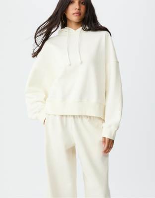Stradivarius - Kapuzenpullover in Ecru mit Stern im Leopardenmuster-Weiß