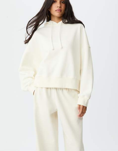 Stradivarius – Kapuzenpullover in Ecru mit Stern im Leopardenmuster - view 1