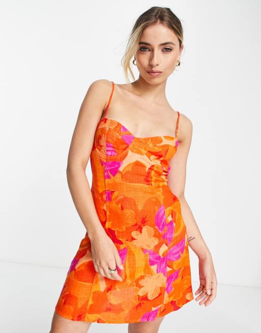 Stradivarius - Korset-minikjole med lyst blomsterprint