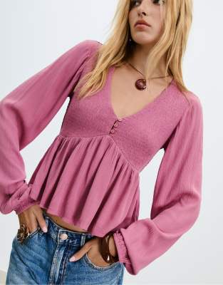 Stradivarius - Langärmlige Bluse in Blassrosa mit lockerem Schnitt