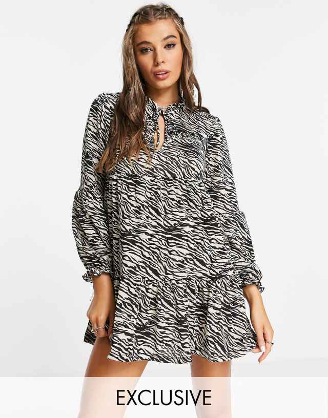 Stradivarius long sleeve smock dress with tie neck in animal print