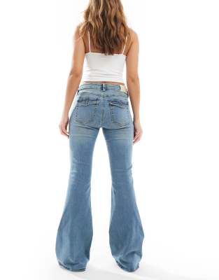 Stradivarius low rise flare jeans in mid blue