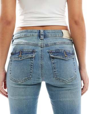 Stradivarius low rise flare jeans in mid blue