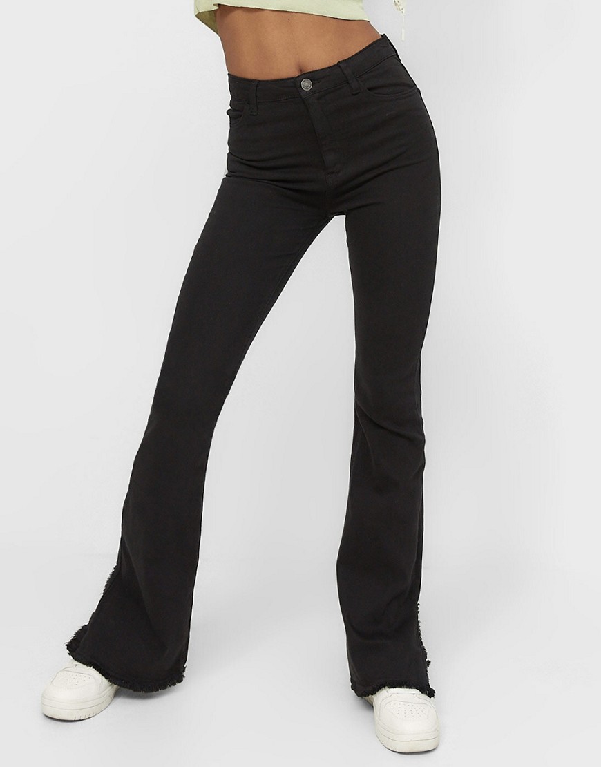 Stradivarius low waist stretch 90s pants with hem split detail in black