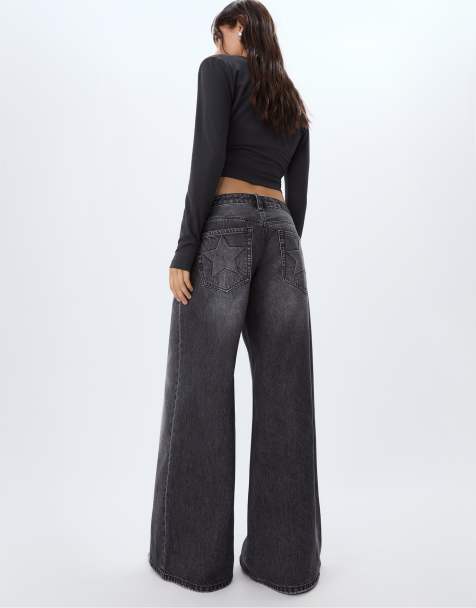 Stradivarius Low-waist wide-leg jeans with stars in black denim washed effect