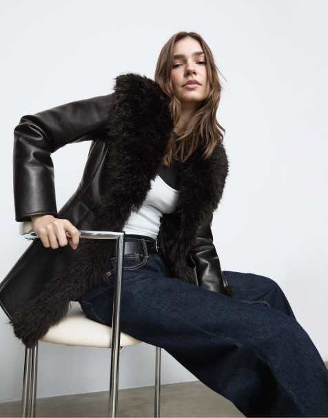 Stradivarius Mid-length leather effect coat with long faux fur in black - view 1