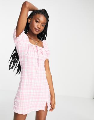 Stradivarius milkmaid seersucker mini dress with slit detail in pink check  | ASOS