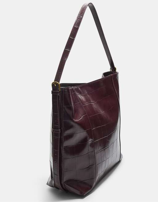 Stradivarius Mock croc bucket bag in burgundy | ASOS