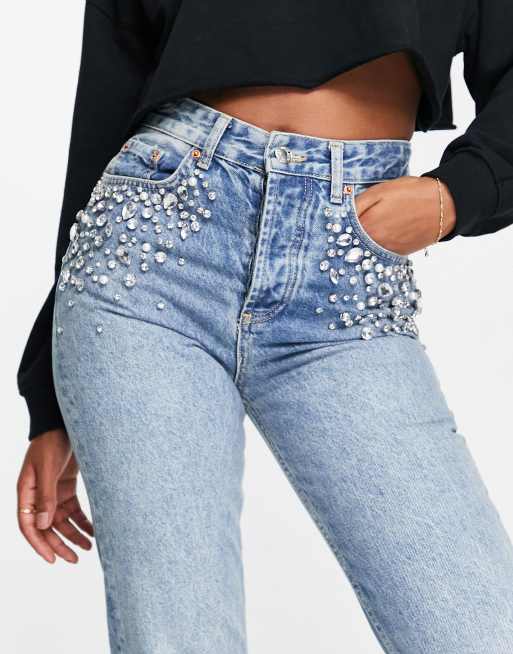 Jeans con store strass