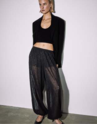 Stradivarius - Pailletten-Ballonhose in Schwarz