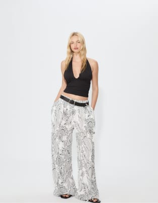 Stradivarius - Palazzo-Hose in Weiß mit Blumenmuster