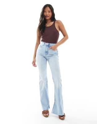 Stradivarius Stradivarius Petite D74 flare slit jean in light wash-Blue