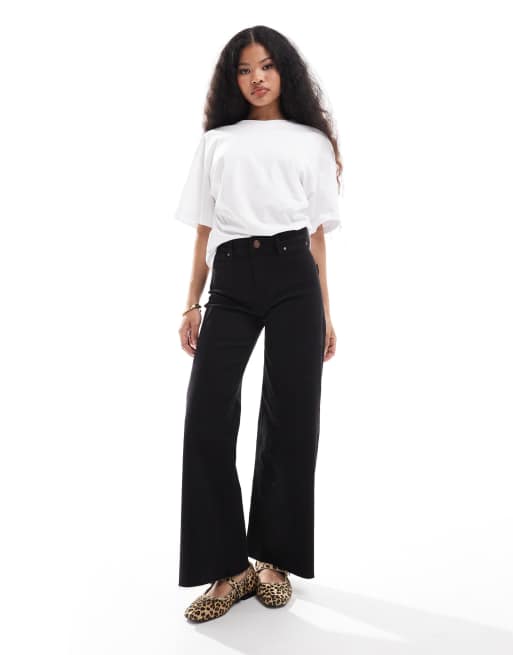Stradivarius Petite - Jeans met wijde pijpen in zwart
