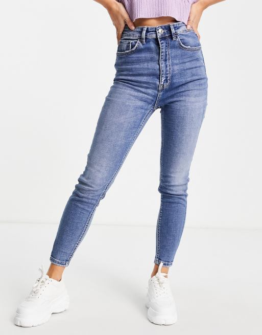 Stradivarius super high waist skinny jeans in with rip in medium blue