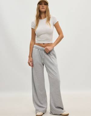 Stradivarius Petite wide-leg jogger trousers in grey melange