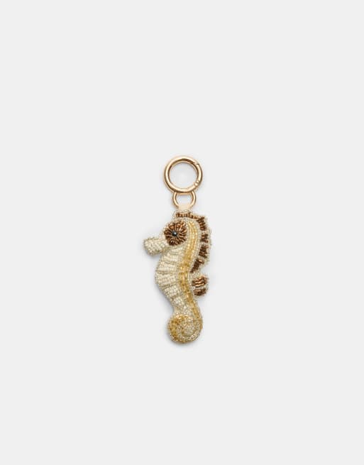 Stradivarius - Portachiavi color oro con charm a forma di cavalluccio marino