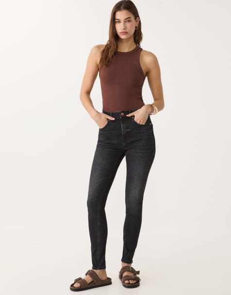 Stradivarius regular waist skinny jeans in dark black - view 1