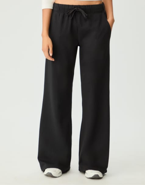 Stradivarius Relaxed fit flared trousers with drawstrings in black - view 1