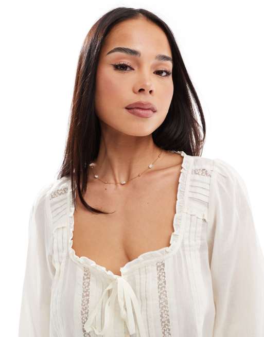 Stradivarius ruffle tie front long sleeve top in white 