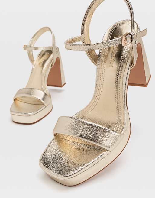 Gouden sandalen met online plateauzool