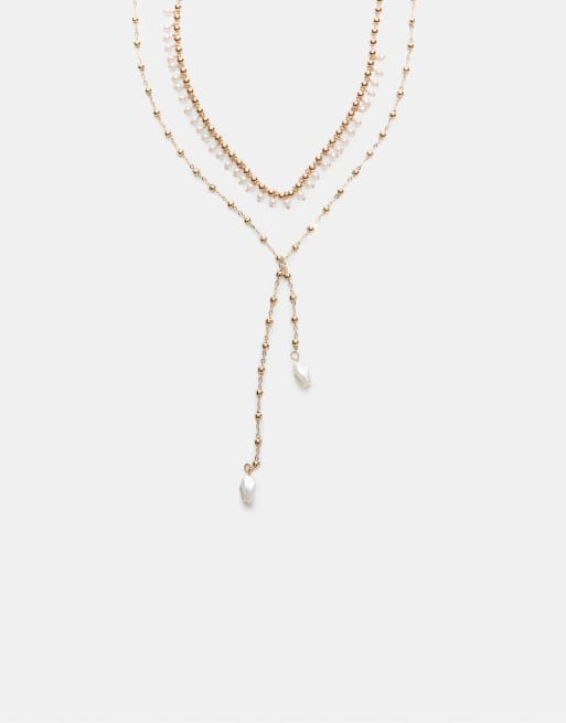 Stradivarius - Set con 2 collane lariat color oro con perle sintetiche