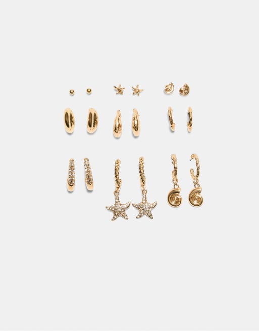 Stradivarius - Set di 9 orecchini a forma di stella marina con strass color oro