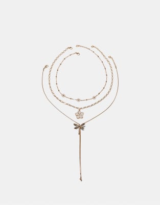 Stradivarius - Set mit 3 Halsketten in Gold-Optik mit Blumen- und Libellenanhängern-Gelb