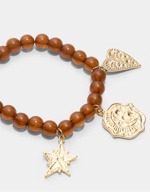Stradivarius - Set van 2 armbanden met kralen en hangertjes in goud, 2 van 3